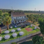Drone photos of dance floor, party tables, large deck, orchard An aerial photo of King Street Orchard in Redlands, California, highlights a perfect blend of natural beauty and event-ready infrastructure, making it the ideal venue for weddings, birthday parties, and retirement celebrations. Located in the tranquil outskirts of Southern California, this expansive venue offers a serene atmosphere that captures the essence of a peaceful countryside setting.
From above, the aerial view showcases vast orchards stretching across the property, providing an enchanting backdrop for any event. The neatly arranged rows of fruit trees exude a rustic charm, creating a romantic and intimate setting for weddings and a relaxed, inviting space for any celebration. The lush greenery and wide-open spaces make it easy to envision an unforgettable event immersed in nature's beauty. The natural surroundings of the orchard require minimal decoration, as the venue itself brings an organic elegance to every occasion.
The aerial photo also reveals a spacious dance floor, perfectly nestled among the trees. This open area serves as a lively focal point for weddings, where guests can dance under the stars, or for birthday and retirement parties, offering a vibrant space for music and celebrations. The dance floor blends seamlessly into the landscape, allowing guests to enjoy the fresh air and scenic views while participating in the festivities.
Adjacent to the dance floor, a large deck is visible, equipped with tables and chairs. This versatile space is ideal for hosting dining receptions, cocktail hours, or simply providing a relaxed seating area for guests. Whether used for dinner or as a place for heartfelt toasts and speeches, the deck adds both functionality and elegance to the event. Overlooking the orchard, the deck allows guests to enjoy the tranquil ambiance while remaining comfortable and connected to the beauty of the outdoors.
King Street Orchard's vast open spaces and natural scenery make it one of Redlands’ best venues for hosting all types of events. Whether you're planning a wedding, a milestone birthday, or a retirement party, the venue’s combination of rustic charm, modern amenities, and serene surroundings offers a unique experience that can be tailored to any event. Its affordability and beauty make it an attractive option for those seeking a peaceful yet captivating location for their special occasions.
An aerial photo of King Street Orchard in Redlands, California, highlights a perfect blend of natural beauty and event-ready infrastructure, making it the ideal venue for weddings, birthday parties, and retirement celebrations. Located in the tranquil outskirts of Southern California, this expansive venue offers a serene atmosphere that captures the essence of a peaceful countryside setting.
From above, the aerial view showcases vast orchards stretching across the property, providing an enchanting backdrop for any event. The neatly arranged rows of fruit trees exude a rustic charm, creating a romantic and intimate setting for weddings and a relaxed, inviting space for any celebration. The lush greenery and wide-open spaces make it easy to envision an unforgettable event immersed in nature's beauty. The natural surroundings of the orchard require minimal decoration, as the venue itself brings an organic elegance to every occasion.
The aerial photo also reveals a spacious dance floor, perfectly nestled among the trees. This open area serves as a lively focal point for weddings, where guests can dance under the stars, or for birthday and retirement parties, offering a vibrant space for music and celebrations. The dance floor blends seamlessly into the landscape, allowing guests to enjoy the fresh air and scenic views while participating in the festivities.
Adjacent to the dance floor, a large deck is visible, equipped with tables and chairs. This versatile space is ideal for hosting dining receptions, cocktail hours, or simply providing a relaxed seating area for guests. Whether used for dinner or as a place for heartfelt toasts and speeches, the deck adds both functionality and elegance to the event. Overlooking the orchard, the deck allows guests to enjoy the tranquil ambiance while remaining comfortable and connected to the beauty of the outdoors.
King Street Orchard's vast open spaces and natural scenery make it one of Redlands’ best venues for hosting all types of events. Whether you're planning a wedding, a milestone birthday, or a retirement party, the venue’s combination of rustic charm, modern amenities, and serene surroundings offers a unique experience that can be tailored to any event. Its affordability and beauty make it an attractive option for those seeking a peaceful yet captivating location for their special occasions.
An aerial photo of King Street Orchard in Redlands, California, highlights a perfect blend of natural beauty and event-ready infrastructure, making it the ideal venue for weddings, birthday parties, and retirement celebrations. Located in the tranquil outskirts of Southern California, this expansive venue offers a serene atmosphere that captures the essence of a peaceful countryside setting.
From above, the aerial view showcases vast orchards stretching across the property, providing an enchanting backdrop for any event. The neatly arranged rows of fruit trees exude a rustic charm, creating a romantic and intimate setting for weddings and a relaxed, inviting space for any celebration. The lush greenery and wide-open spaces make it easy to envision an unforgettable event immersed in nature's beauty. The natural surroundings of the orchard require minimal decoration, as the venue itself brings an organic elegance to every occasion.
The aerial photo also reveals a spacious dance floor, perfectly nestled among the trees. This open area serves as a lively focal point for weddings, where guests can dance under the stars, or for birthday and retirement parties, offering a vibrant space for music and celebrations. The dance floor blends seamlessly into the landscape, allowing guests to enjoy the fresh air and scenic views while participating in the festivities.
Adjacent to the dance floor, a large deck is visible, equipped with tables and chairs. This versatile space is ideal for hosting dining receptions, cocktail hours, or simply providing a relaxed seating area for guests. Whether used for dinner or as a place for heartfelt toasts and speeches, the deck adds both functionality and elegance to the event. Overlooking the orchard, the deck allows guests to enjoy the tranquil ambiance while remaining comfortable and connected to the beauty of the outdoors.
King Street Orchard's vast open spaces and natural scenery make it one of Redlands’ best venues for hosting all types of events. Whether you're planning a wedding, a milestone birthday, or a retirement party, the venue’s combination of rustic charm, modern amenities, and serene surroundings offers a unique experience that can be tailored to any event. Its affordability and beauty make it an attractive option for those seeking a peaceful yet captivating location for their special occasions.
An aerial photo of King Street Orchard in Redlands, California, showcases a picturesque and tranquil setting, ideal for weddings, birthday parties, and retirement celebrations. The vast orchards, with their neatly aligned rows of fruit trees, create a natural and serene backdrop, perfect for outdoor events that want to capture a rustic charm.
The photo reveals a spacious dance floor, nestled amid the greenery, providing a lively spot for guests to celebrate under the open sky. This space is perfect for weddings or parties, where dancing is a central part of the festivities. Surrounding the dance floor, you can see well-arranged tables and chairs, offering ample seating for dining and socializing, all while enjoying the fresh air and beautiful surroundings.
The large deck area visible from the aerial view serves as a versatile space for various event activities, such as cocktail hours, dinner receptions, or simply a relaxed gathering spot for guests. Overlooking the orchards, the deck provides a breathtaking view of the property, enhancing the experience with its peaceful ambiance.
With its blend of natural beauty and functional event spaces, King Street Orchard stands out as one of Redlands' best venues for special events, combining charm, tranquility, and affordability.