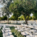The Best Wedding Venue in Redlands – King Street Orchard

When it comes to finding the best wedding venue in Redlands, California, few places compare to the natural beauty and timeless charm of King Street Orchard. Nestled among citrus and avocado trees, this lovingly restored 1906 farmhouse offers a one-of-a-kind outdoor setting that perfectly blends rustic elegance with modern comfort.

Couples exchange vows beneath the open sky, surrounded by lush greenery and the gentle fragrance of orange blossoms. The spacious 800-square-foot deck and 3,000-square-foot lawn provide endless possibilities for ceremonies, dining, and dancing under the stars. As the sun sets, string lights twinkle above, and the orchard transforms into a romantic haven filled with warmth and joy.

King Street Orchard provides everything you need for a seamless celebration—tables, chairs, linens, ADA-compliant restrooms, and the flexibility to create a wedding that reflects your unique style. Whether you envision a grand event or an intimate gathering, every detail is embraced with care and hospitality.

From the moment guests arrive, they’re captivated by the peaceful landscape and heartfelt atmosphere. King Street Orchard isn’t just a venue—it’s an experience that captures love, nature, and unforgettable memories in the heart of Redlands.